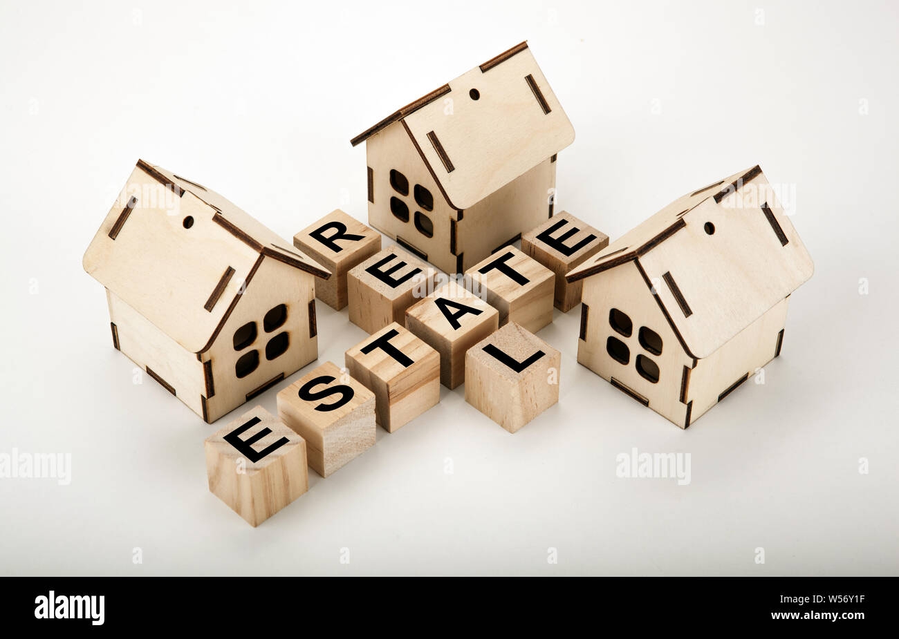 Cubes With Inscription Real Estate In The Form Of A Crossword Puzzle With Three Miniature Houses Stock Photo Alamy